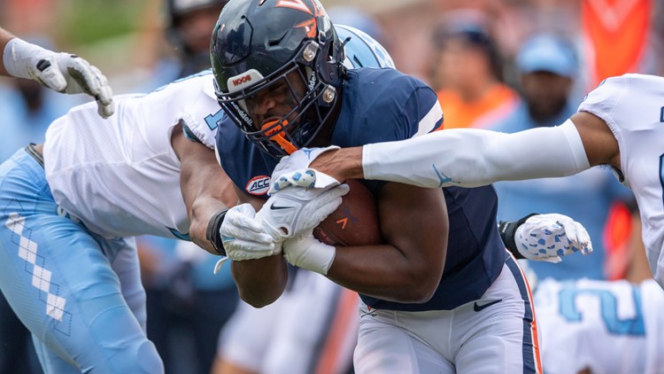 Virginia player wounded in deadly attack returns for a new season as an inspiration to his teammates
